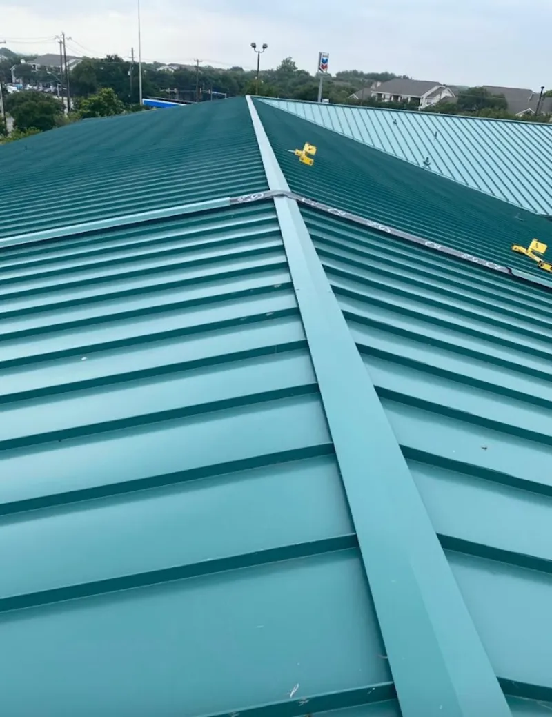 Green commercial metal roof ridge and valley for Metal Roof Repair in New Carlisle